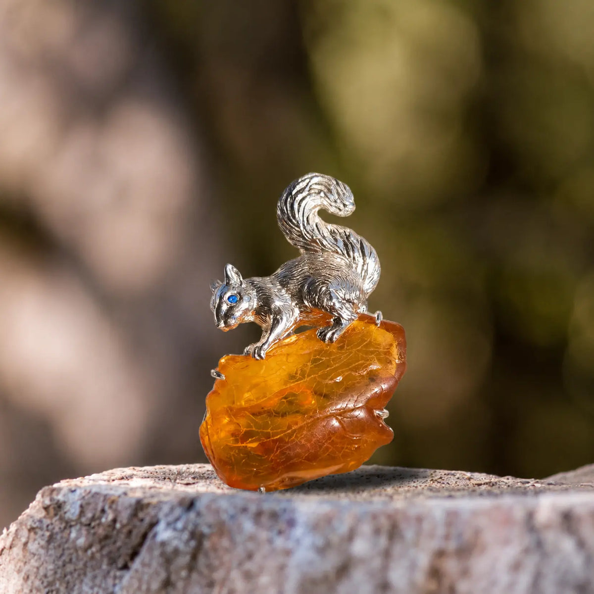Natural stone brooch with natural amber — curled-tail squirrel silver brooch styling photo