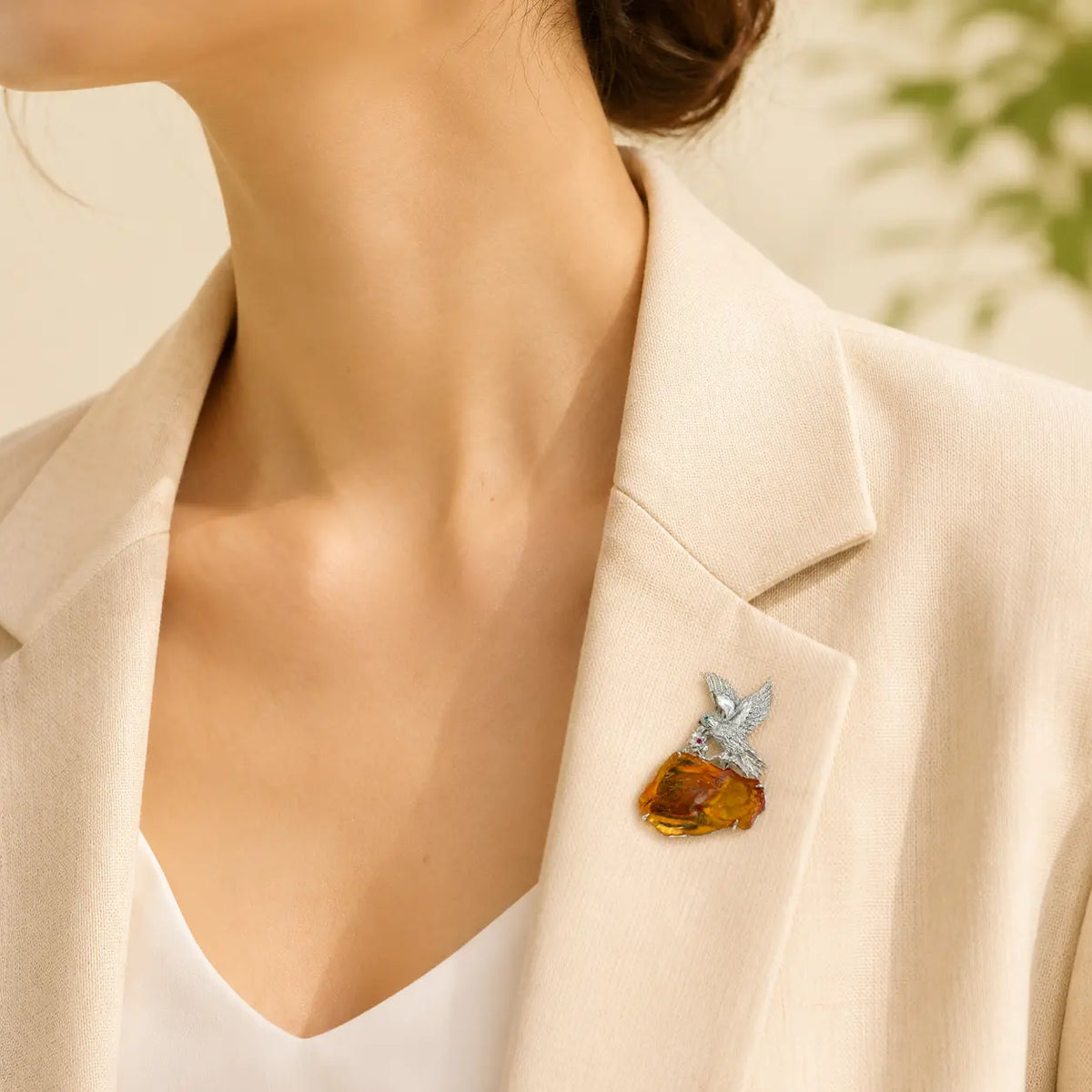 Artisan sterling silver spreading wings eagle brooch styling detail with natural amber