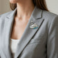 Artisan sterling silver crowned swan brooch styling detail with baroque pearl
