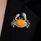 Handmade raised-claw crab silver brooch worn on clothing — convertible pendant styling photo