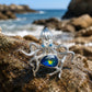 blue-green enamel curling tentacle octopus silver brooch in a nature-inspired styling photo