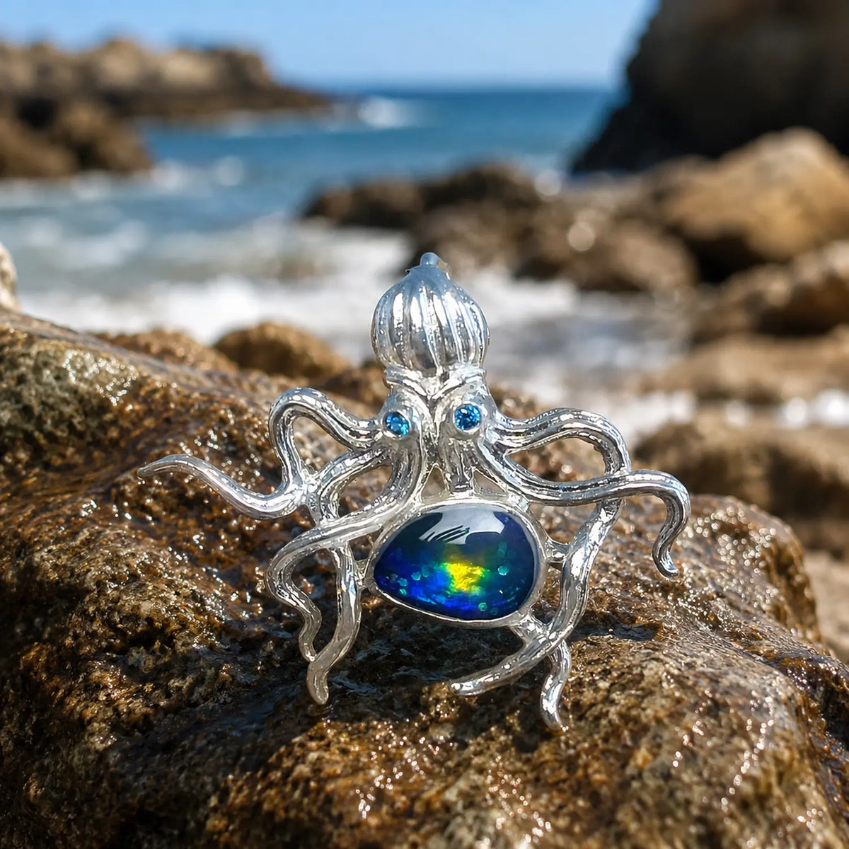 blue-green enamel curling tentacle octopus silver brooch in a nature-inspired styling photo