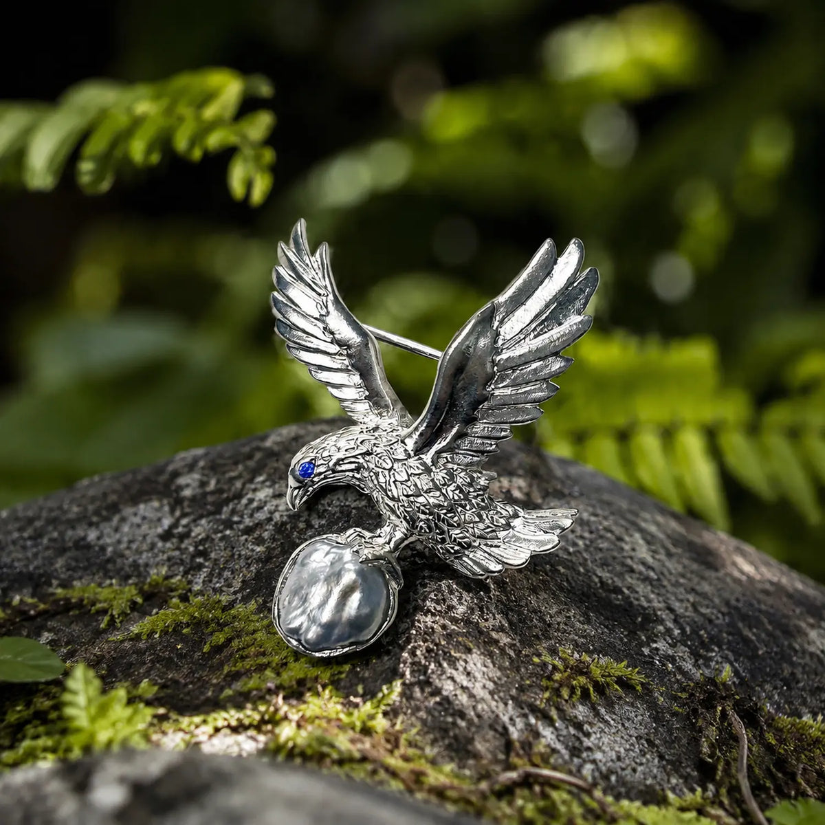 baroque saltwater pearl perched eagle silver brooch in a nature-inspired styling photo
