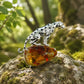Natural stone brooch with natural flower amber — prowling leopard silver brooch styling photo