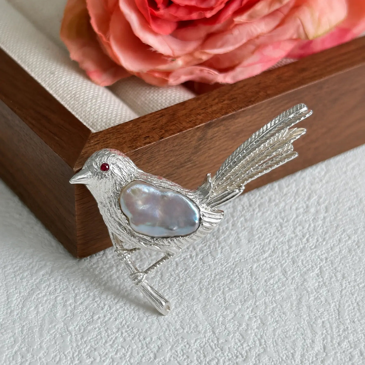 Handmade brooch for women — baroque pearl perched songbird silver brooch styling photo