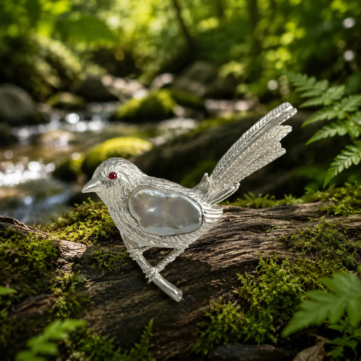 baroque pearl perched songbird silver brooch in a nature-inspired styling photo