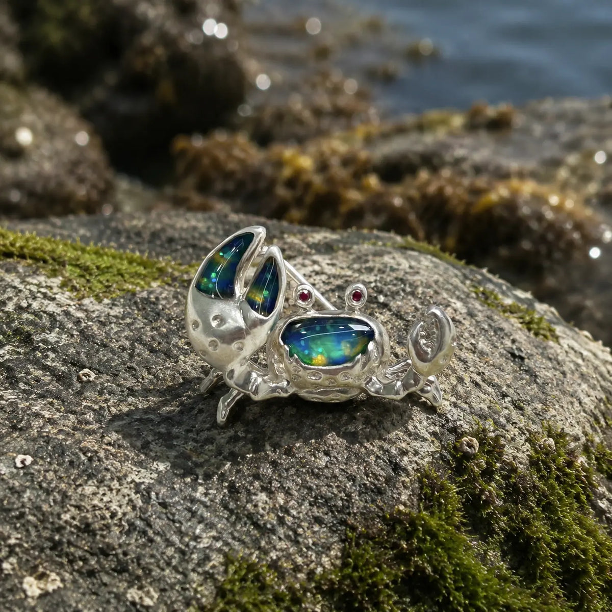 iridescent blue-green enamel shore crab silver brooch in a nature-inspired styling photo