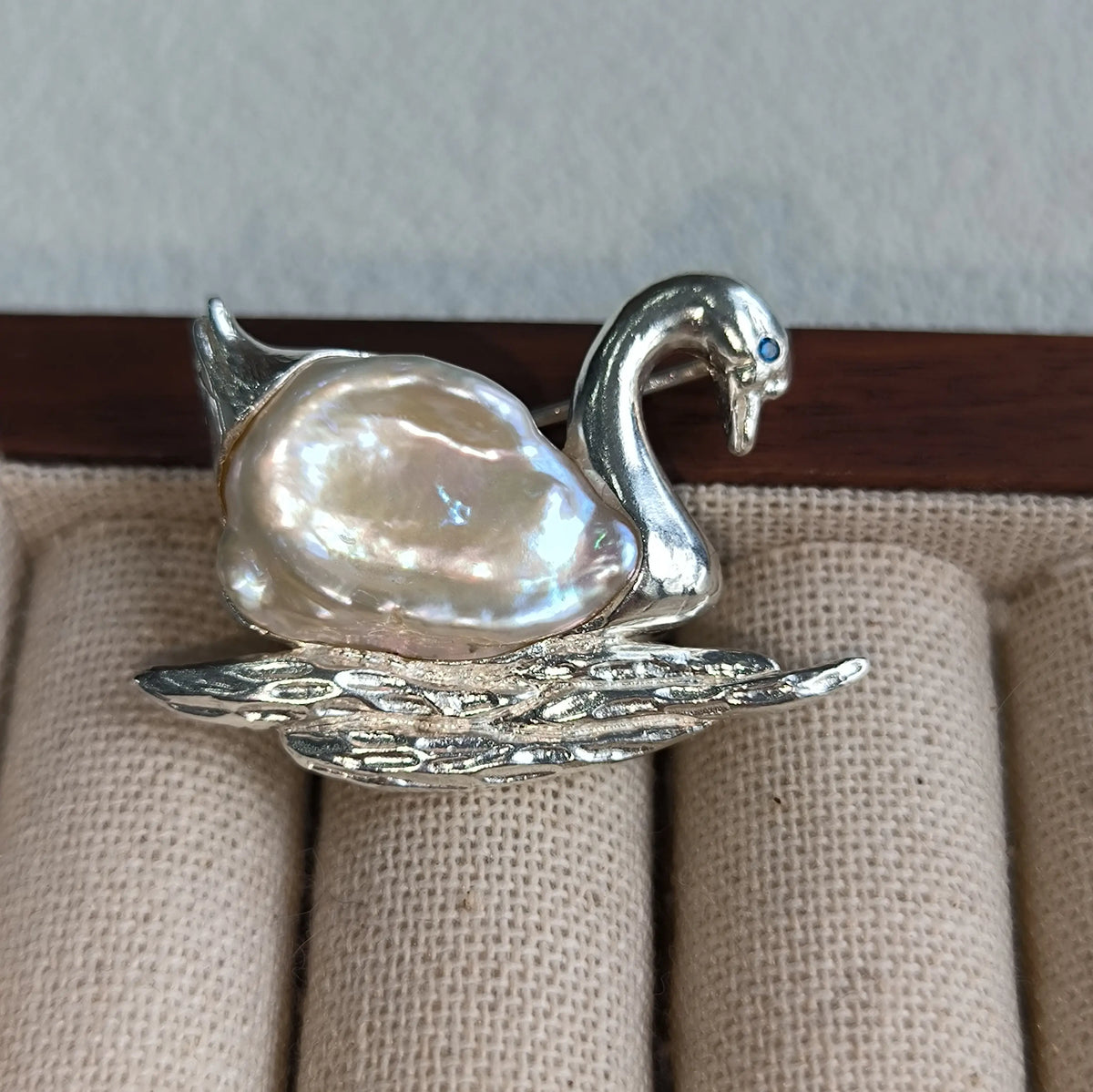 2-in-1 serene swan silver brooch and pendant styled on fabric