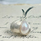 Artisan silver peeled garlic brooch — handmade jewelry product image