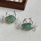 natural jadeite spread-claw crab silver brooch detail — jewelry close-up photo