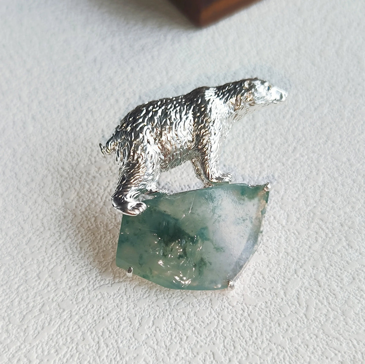 Handmade gemstone brooch with natural jadeite — arctic polar bear detail photo