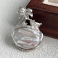 2-in-1 coconut palm tree silver brooch and pendant styled on fabric