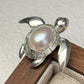 Handmade brooch for women — baroque pearl shell swimming sea turtle silver brooch styling photo