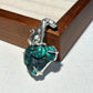 Convertible seated leopard silver pendant and brooch in a styling photo