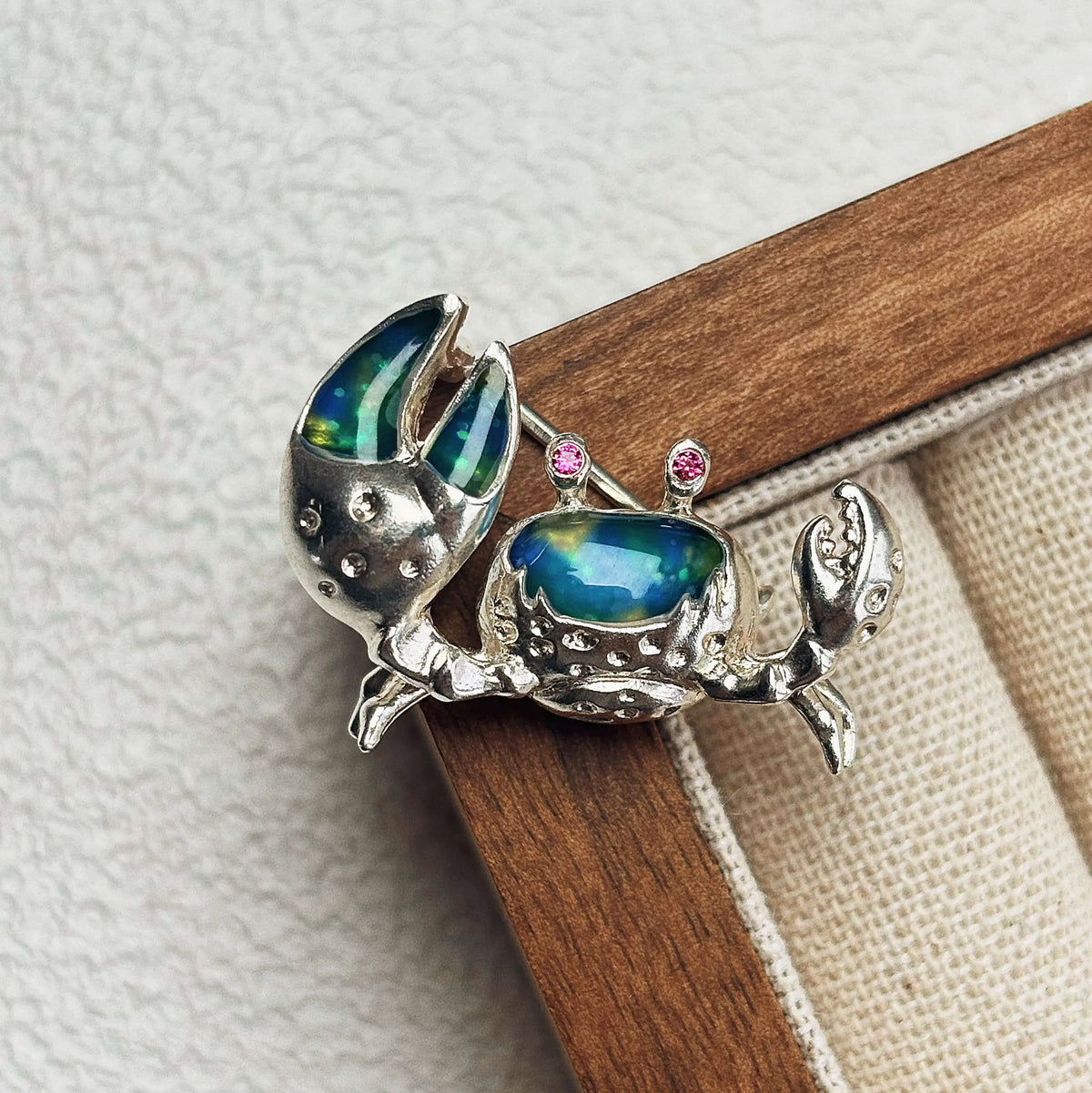 Handmade brooch for women — iridescent blue-green enamel shore crab silver brooch styling photo