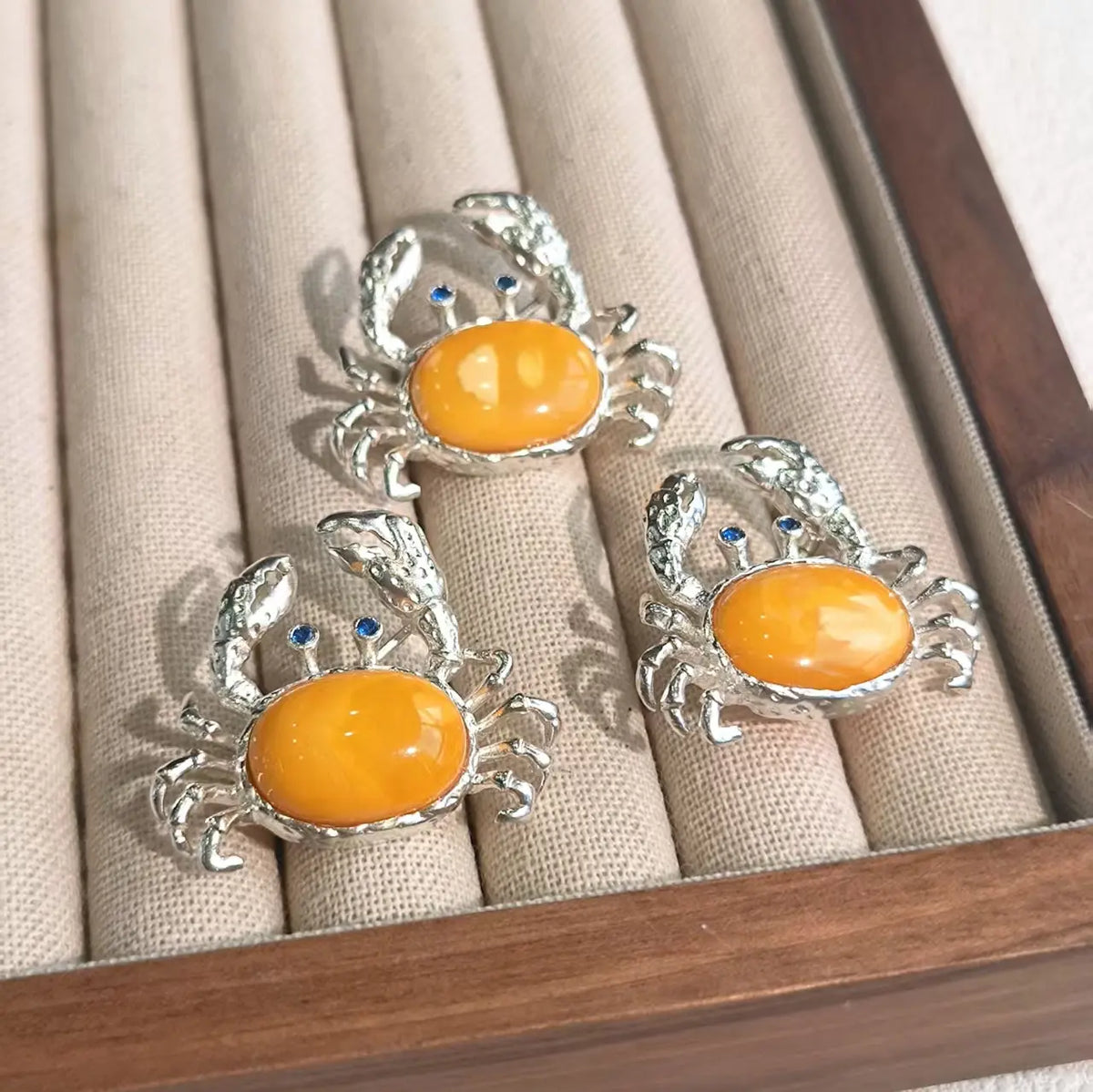 Unique natural amber raised-claw crab brooch for women — artisan styling detail