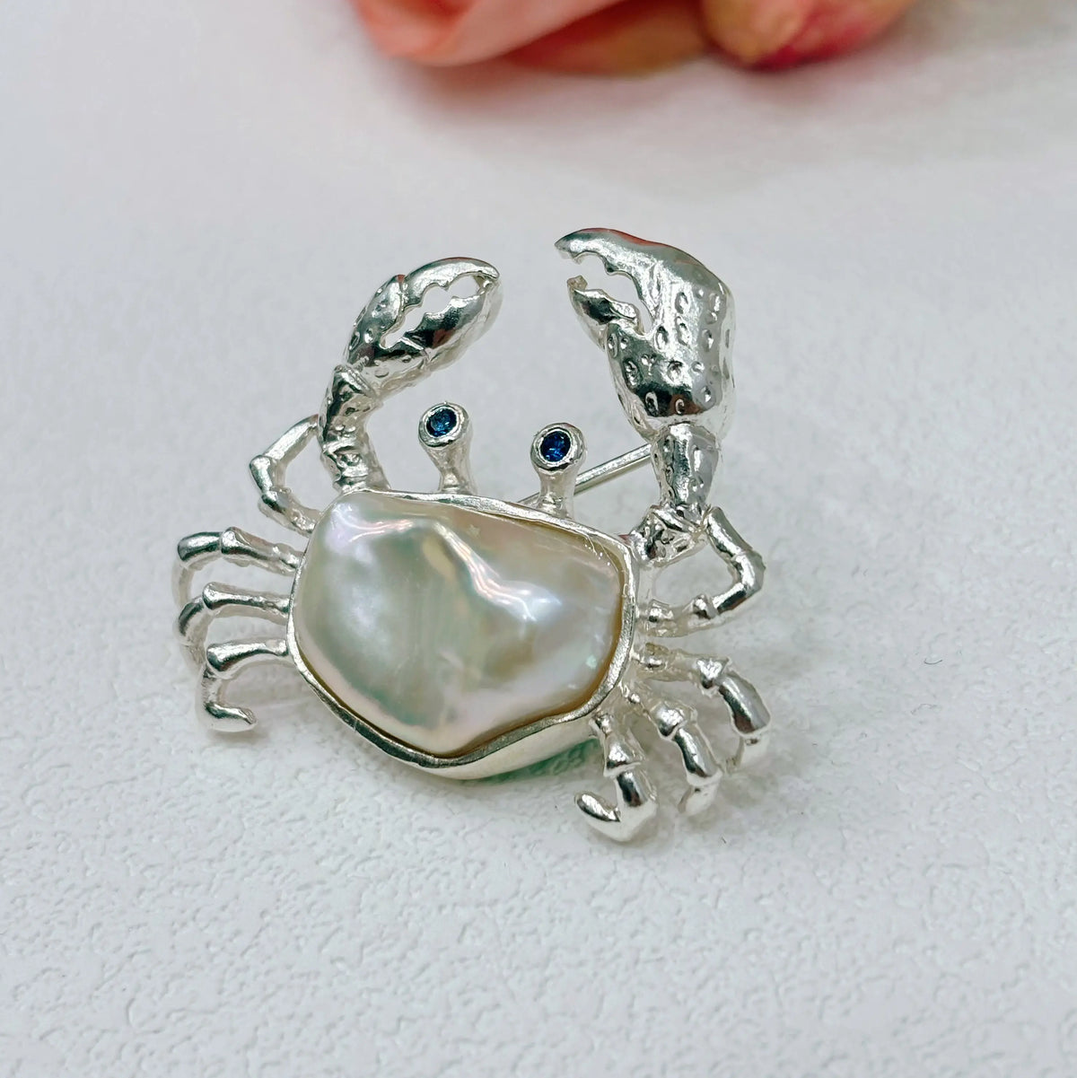 Artisan sterling silver ocean crab brooch styling detail with baroque pearl shell