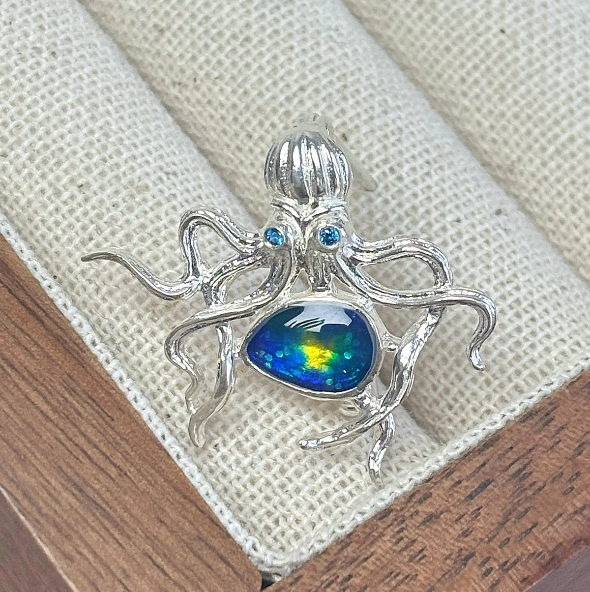 Artisan sterling silver curling tentacle octopus brooch styling detail with blue-green enamel