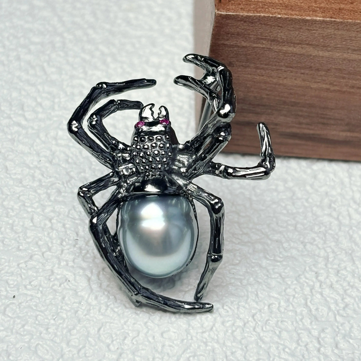 Artisan silver creeping spider brooch — handmade jewelry product image
