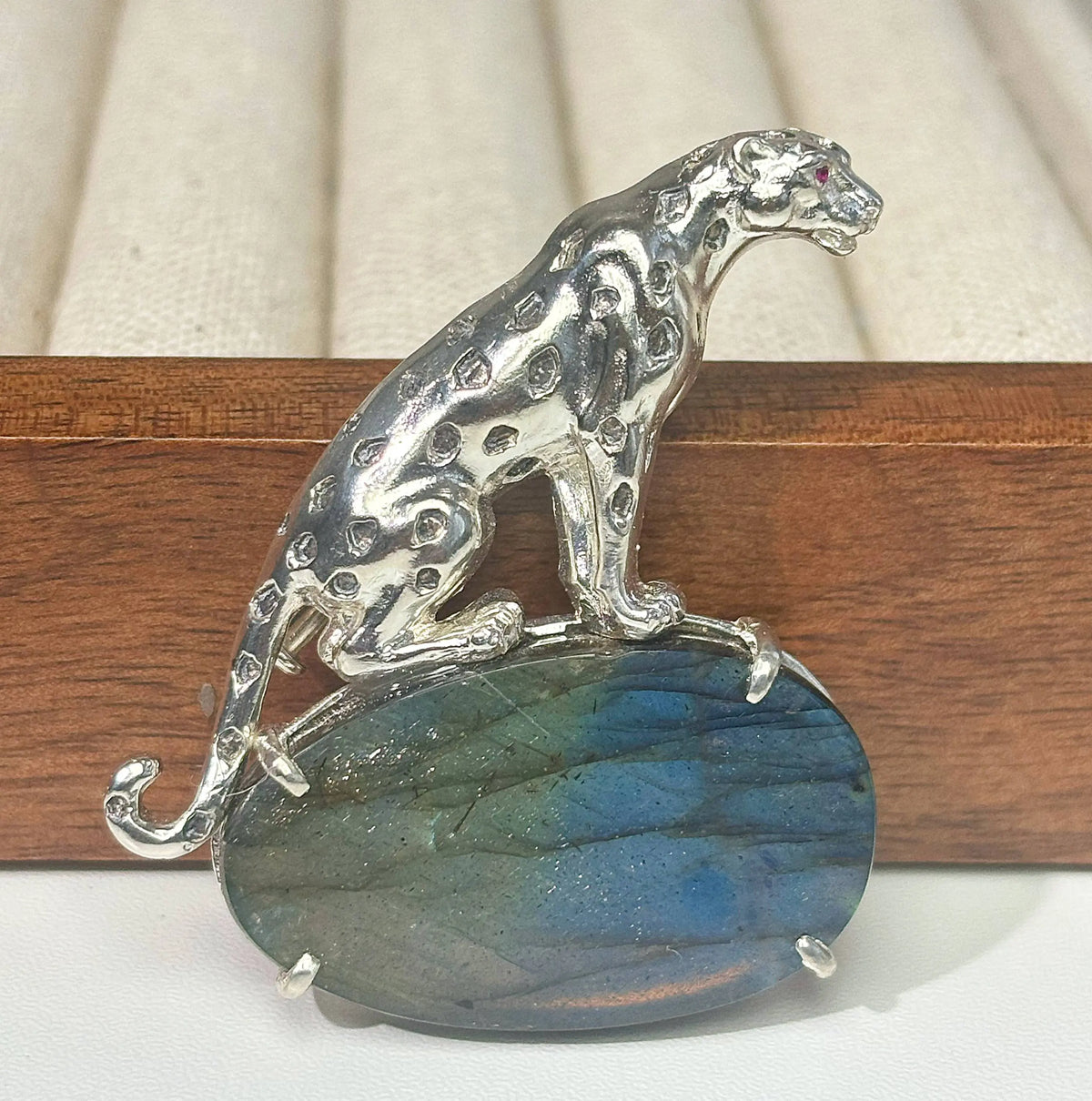 Artisan sterling silver stalking leopard brooch styling detail with blue flash labradorite