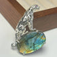 Handmade brooch for women — blue flash labradorite stalking leopard silver brooch styling photo
