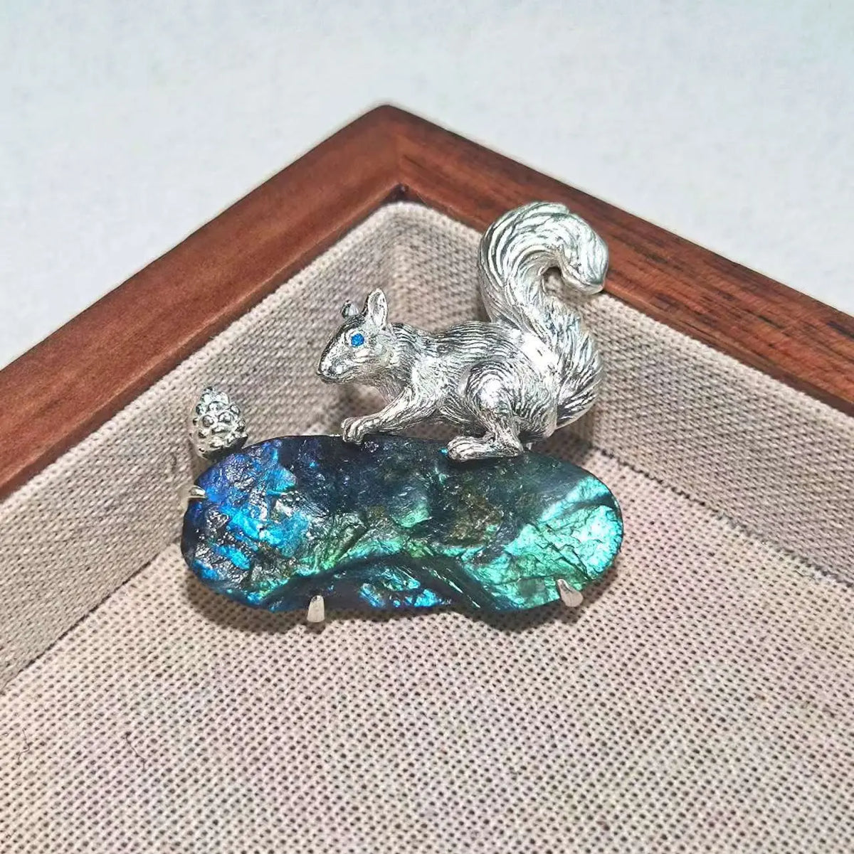 2-in-1 foraging squirrel silver brooch and pendant styled on fabric