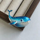 2-in-1 gliding whale silver brooch and pendant styled on fabric