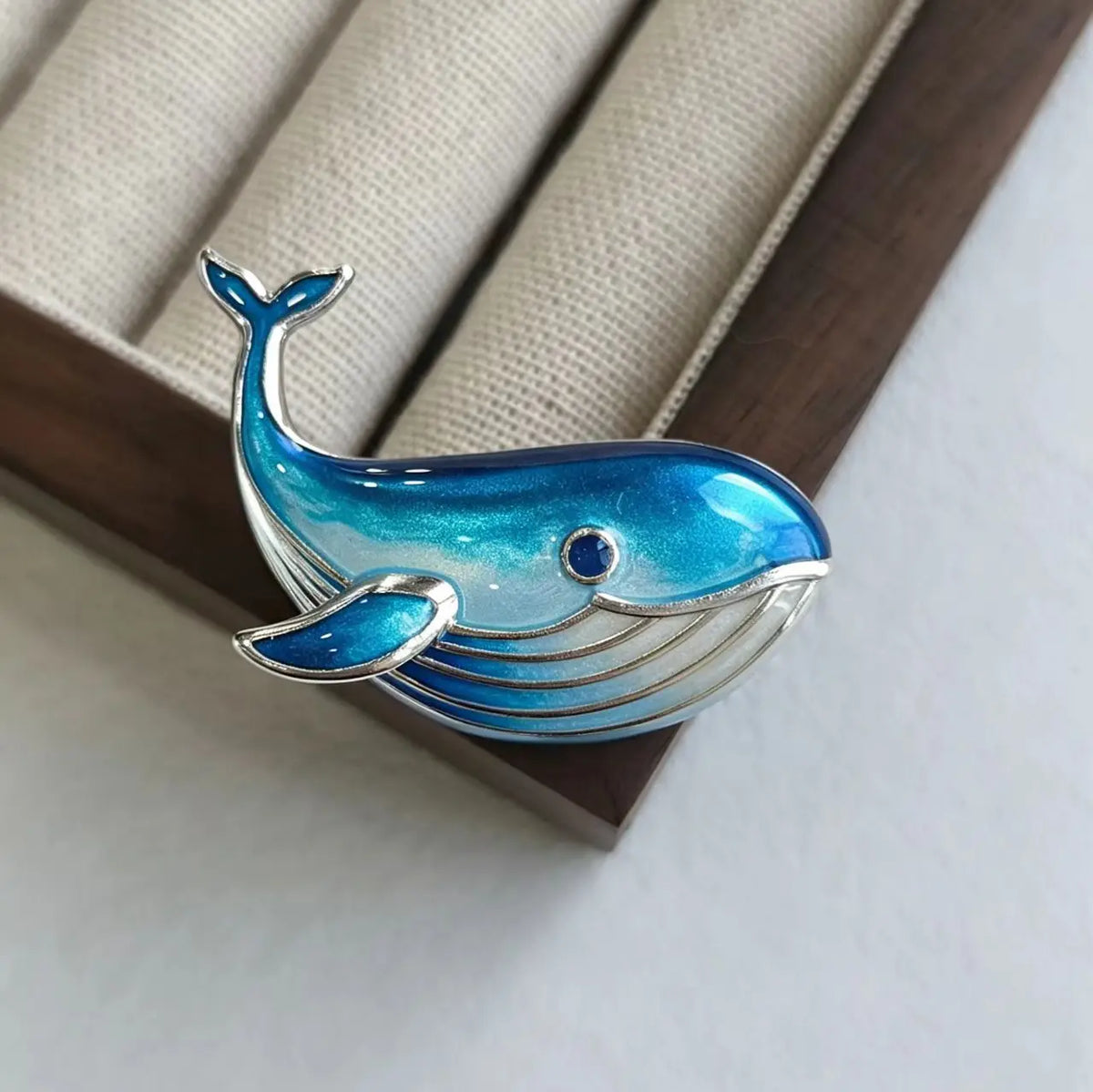 2-in-1 gliding whale silver brooch and pendant styled on fabric