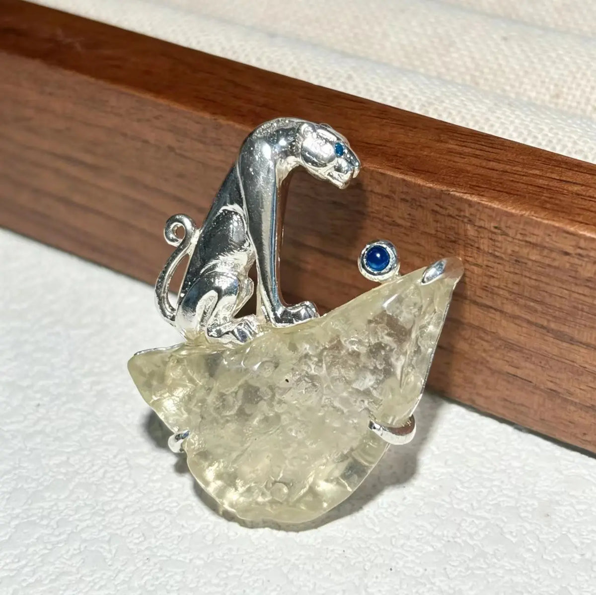 Handmade desert glass curled leopard brooch for women — wearable silver jewelry detail