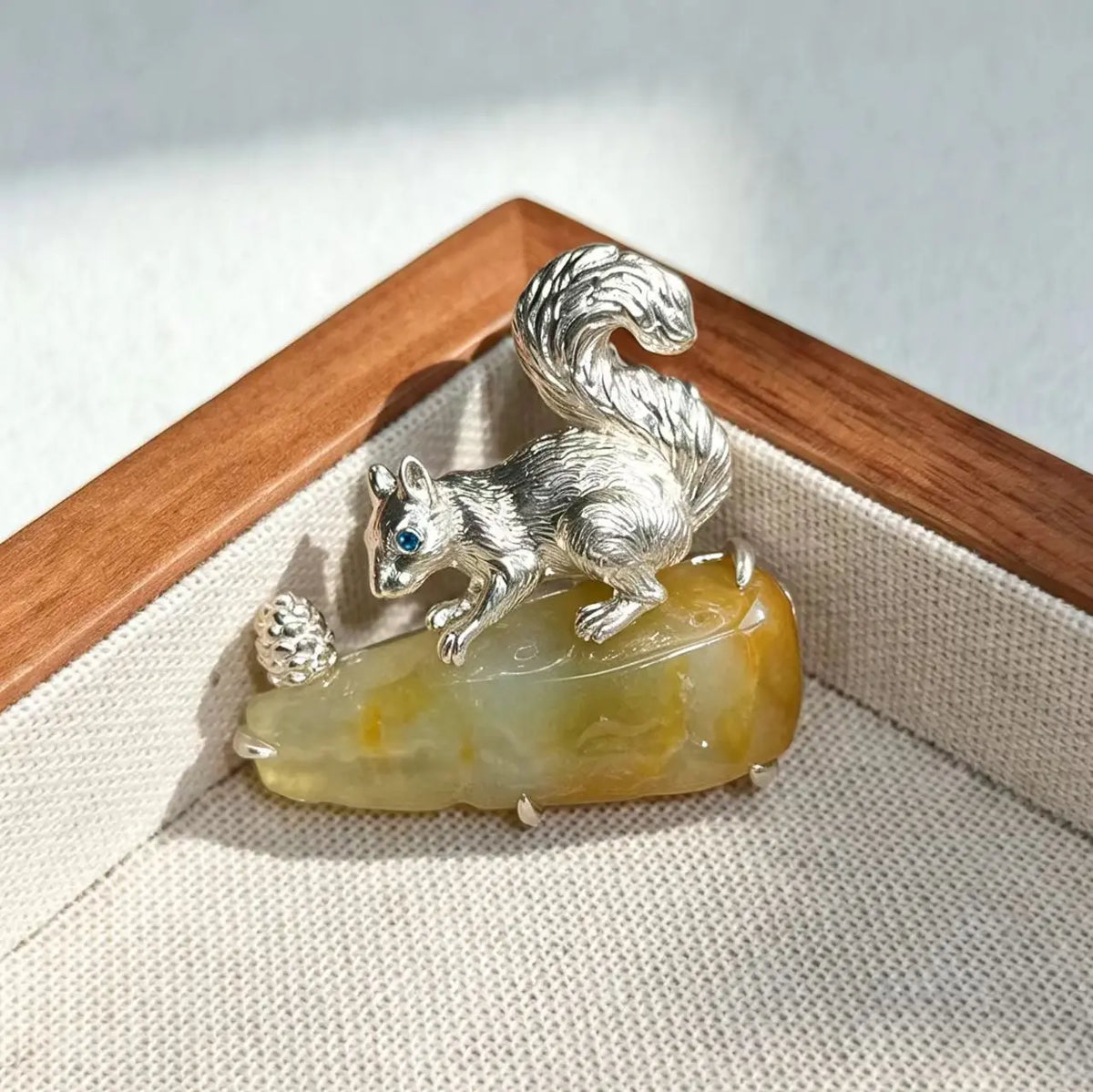 2-in-1 gathering squirrel silver brooch and pendant styled on fabric