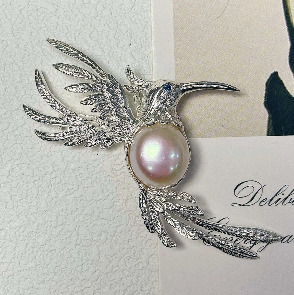 Artisan silver fluttering hummingbird brooch — handmade jewelry product image