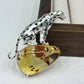 2-in-1 prowling leopard silver brooch and pendant styled on fabric