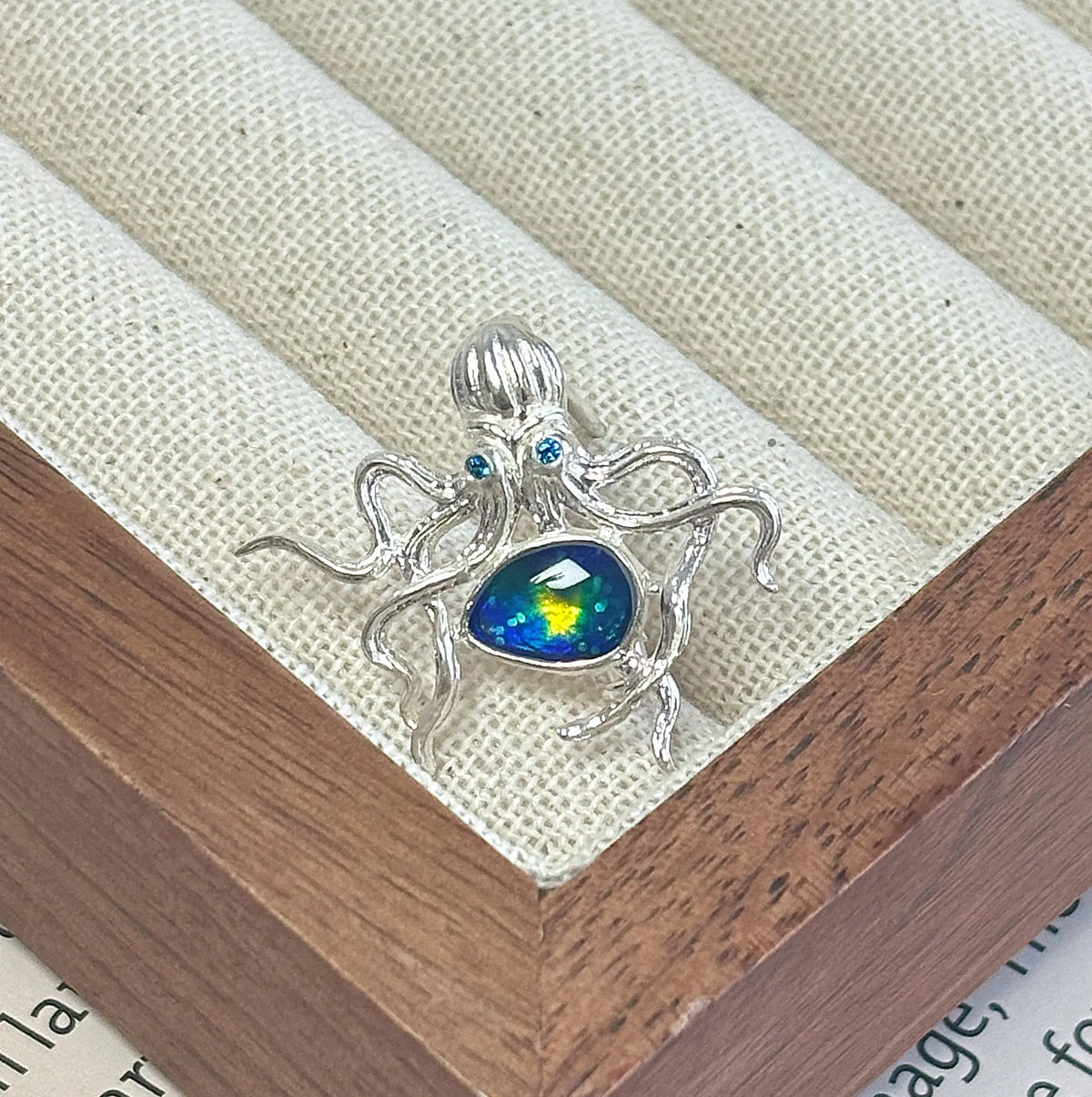 2-in-1 curling tentacle octopus silver brooch and pendant styled on fabric