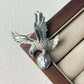2-in-1 perched eagle silver brooch and pendant styled on fabric