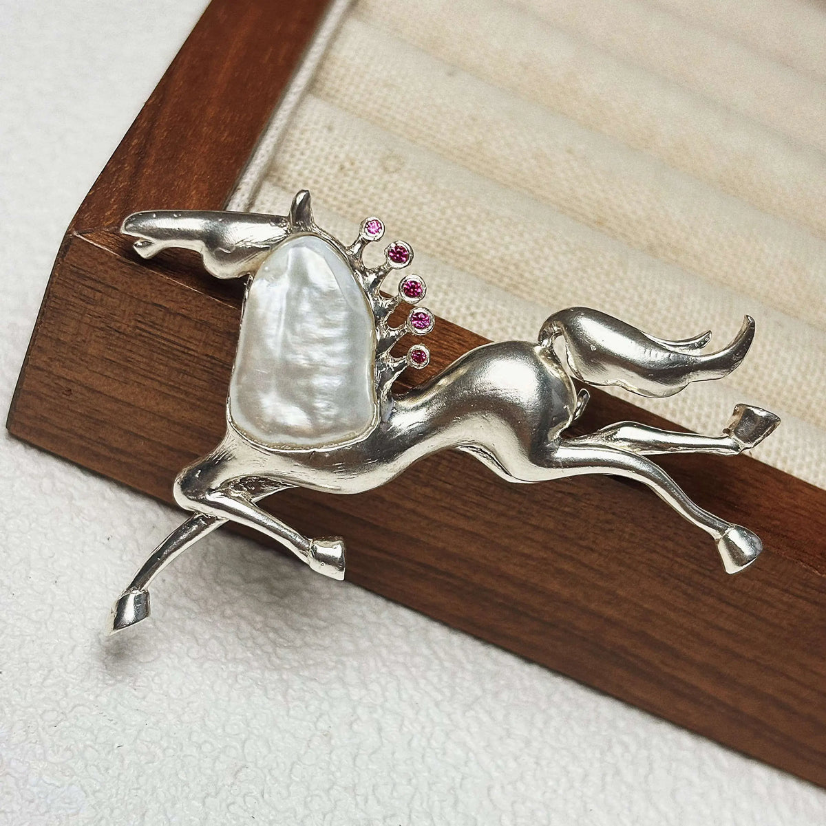 2-in-1 galloping horse silver brooch and pendant styled on fabric