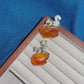 Product video: handmade silver curled-tail squirrel brooch and convertible pendant